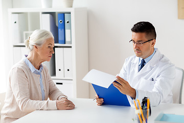 Image showing senior woman and doctor meeting at hospital