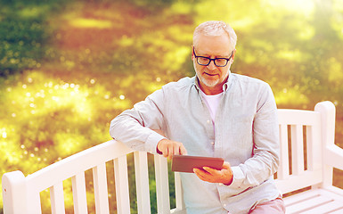 Image showing senior man with tablet pc at summer park