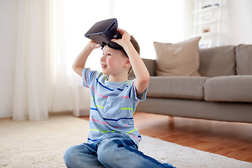 Image showing little boy in vr headset or 3d glasses at home