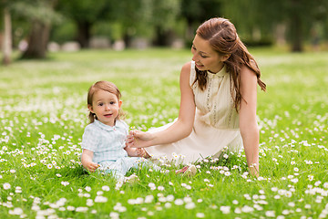 Image showing happy mother with baby girl at summer park