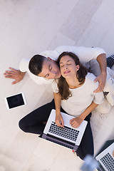 Image showing couple using tablet and laptop computers top view