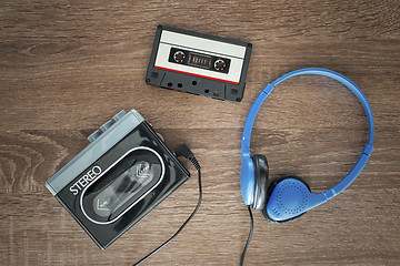 Image showing Vintage walkman, cassete and headphones.