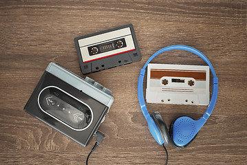 Image showing Vintage walkman, cassete and headphones.