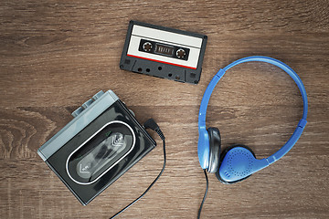 Image showing Vintage walkman, cassete and headphones.