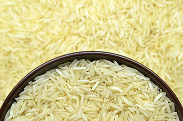 Image showing White basmati rice with wooden bowl