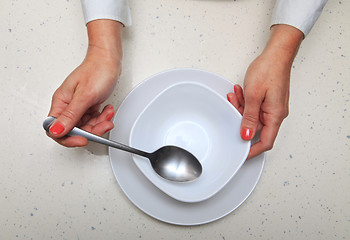 Image showing woman holds spoon and plate