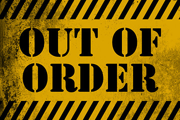 Image showing Out of order sign yellow with stripes