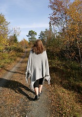 Image showing Woman walking in autumn