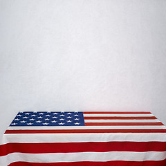 Image showing American flag table near the white wall