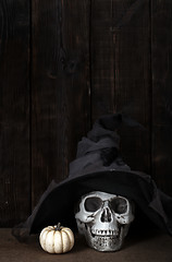 Image showing Halloween pumpkin and human skull in witch hat