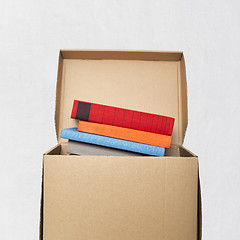 Image showing cardboard box full of books