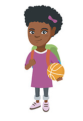 Image showing Schoolgirl with backpack holding a basketball.