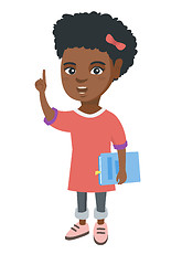 Image showing Little african schoolgirl pointing forefinger up.