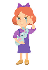 Image showing Caucasian girl crying and holding toy.