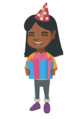 Image showing African girl in birthday cap holding gift box.