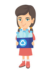 Image showing Girl holding recycling bin full of plastic bottles