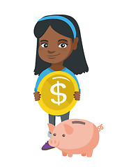 Image showing African girl putting a coin into a piggy bank.