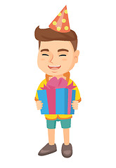 Image showing Caucasian boy in birthday cap holding gift box.