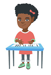 Image showing Little african-american girl playing the piano.