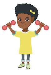 Image showing Little smiling african girl holding dumbbells.