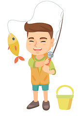 Image showing Little boy holding fishing rod with fish on hook.