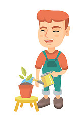 Image showing Caucasian boy watering plant with a watering can.