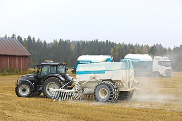 Image showing Transporting and Spraying Agrilime on Field