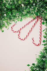 Image showing Green tinsel with candy canes decoration, retro toned