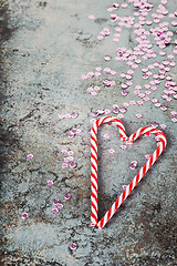 Image showing Christmas decorations - candy canes and sequins, retro toned