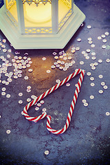 Image showing Christmas decorations - lantern and candy canes, retro toned