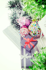 Image showing Top view on christmas present boxes and tinsel, retro toned