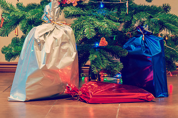 Image showing Christmas presents under the tree, retro toned