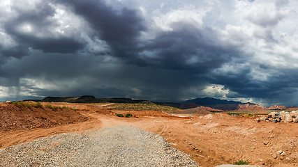 Image showing Ominous Stormy Sky and Cumulus Clouds with Rain in the Desert