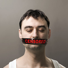 Image showing man with censored tape on face