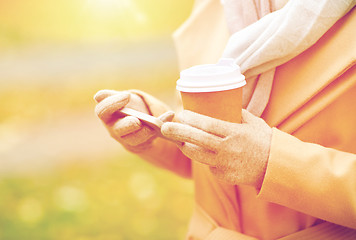 Image showing close up of woman with smartphone and coffee