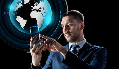 Image showing businessman with smartphone and virtual globe