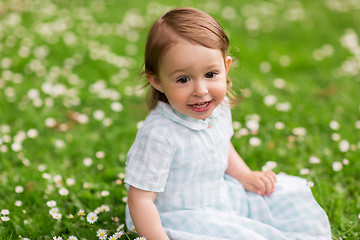 Image showing happy baby girl on green summer field