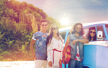 Image showing happy hippie friends at minivan car on island