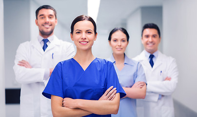 Image showing happy group of medics or doctors at hospital