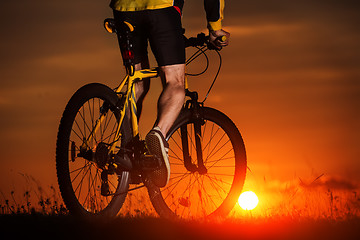 Image showing Silhouette of a bike on sky background