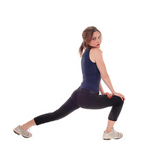 Image showing Woman stretch her legs.