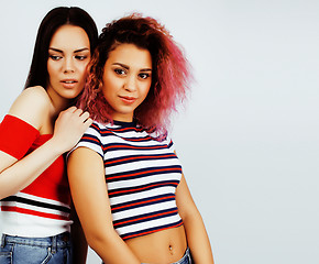 Image showing best friends teenage girls together having fun, posing emotional on white background, besties happy smiling, lifestyle people concept, blond and brunette multi nations 