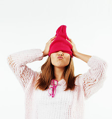 Image showing young pretty teenage hipster girl posing emotional happy smiling on white background, lifestyle people concept 