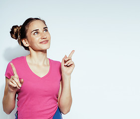 Image showing young pretty teenage hipster girl posing emotional happy smiling on white background, lifestyle people concept 