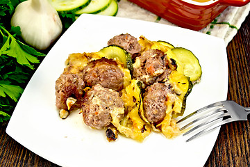 Image showing Meatballs with cheese and squash in plate on dark board