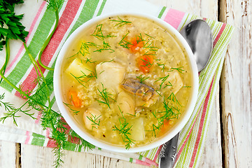 Image showing Soup fish with millet on board top