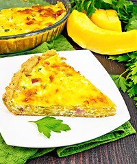 Image showing Quiche with pumpkin and bacon in plate on board