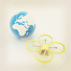 Image showing Quadrocopter Drone with Earth Globe and remote controller on a w