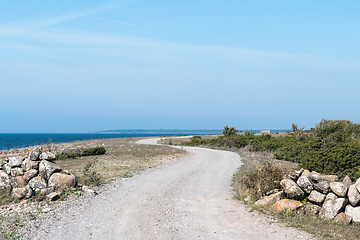 Image showing Winding gravel road by the coast