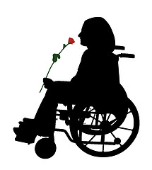 Image showing Disabled person in wheelchair with red rose